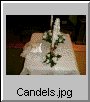 The candles and the pillow with the rings.